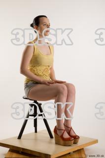 Sitting reference of whole body yellow t shirt gray shorts…